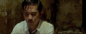 Movie still from “2046” (2004), directed by Kar-Wai Wong – A person wearing a shirt and tie; Close Up shot, Low angle