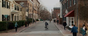 Movie still from “21” (2008), directed by Robert Luketic – A man riding a bike down the middle of a street; Extreme Wide shot, High angle