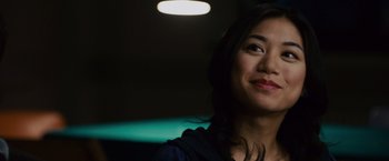 Movie still from “21” (2008), directed by Robert Luketic – A person smiling at the camera; Close Up shot, Over the shoulder angle