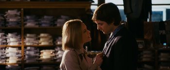 Movie still from “21” (2008), directed by Robert Luketic – A man and a woman standing next to each other; Medium shot, Over the shoulder angle