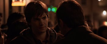 Movie still from “21” (2008), directed by Robert Luketic – A man is talking to another man in the dark; Close Up shot, Over the shoulder angle