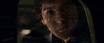 Movie still from “21” (2008), directed by Robert Luketic – A young man looking out of a window at a city skyline at night; Extreme Close Up shot, Overhead angle