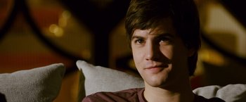 Movie still from “21” (2008), directed by Robert Luketic – A person sitting on a couch; Close Up shot, Over the shoulder angle