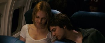Movie still from “21” (2008), directed by Robert Luketic – A man and a woman are sleeping on a train; Close Up shot, Over the shoulder angle