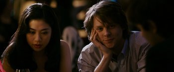 Movie still from “21” (2008), directed by Robert Luketic – A man sitting in front of a mirror with his hand on his face; Close Up shot, Over the shoulder angle