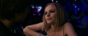 Movie still from “21” (2008), directed by Robert Luketic – A beautiful young lady sitting at a table; Close Up shot, Over the shoulder angle