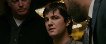 Movie still from “21” (2008), directed by Robert Luketic – A person wearing a jacket; Close Up shot, Over the shoulder angle