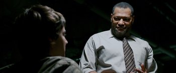 Movie still from “21” (2008), directed by Robert Luketic – A man with a beard talking to a young boy; Medium shot, Over the shoulder angle