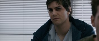 Movie still from “21” (2008), directed by Robert Luketic – A young man wearing a blue jacket looking at the camera; Close Up shot, Over the shoulder angle