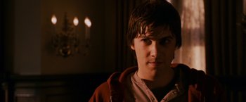 Movie still from “21” (2008), directed by Robert Luketic – A young man is looking into the camera; Close Up shot, Over the shoulder angle