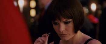 Movie still from “21” (2008), directed by Robert Luketic – A person holding a cell phone; Close Up shot, Over the shoulder angle