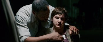 Movie still from “21” (2008), directed by Robert Luketic – A man with a beard and a man with short hair; Close Up shot, Over the shoulder angle