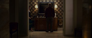 Movie still from “21” (2008), directed by Robert Luketic – A man and a woman standing in front of a bathroom mirror; Wide shot, Over the shoulder angle