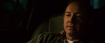 Movie still from “21” (2008), directed by Robert Luketic – A person sitting in a car seat; Close Up shot, Over the shoulder angle
