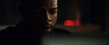 Movie still from “21 Bridges” (2019), directed by Brian Kirk – A person looking at a computer screen; Close Up shot, Over the shoulder angle