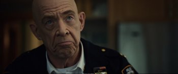 Movie still from “21 Bridges” (2019), directed by Brian Kirk – An older man in a military uniform with blue eyes; Close Up shot, Over the shoulder angle