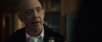 Movie still from “21 Bridges” (2019), directed by Brian Kirk – A man in a military uniform is looking at the camera; Close Up shot, Over the shoulder angle