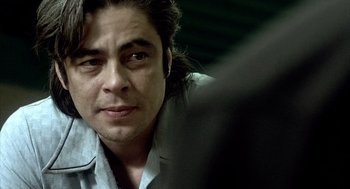 Movie still from “21 Grams” (2003), directed by Alejandro G. Iñárritu – A person with long hair; Close Up shot, Over the shoulder angle