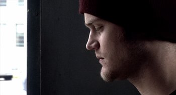 Movie still from “21 Grams” (2003), directed by Alejandro G. Iñárritu – A person wearing a hat; Close Up shot, Low angle