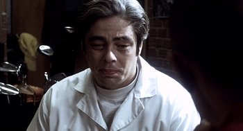 Movie still from “21 Grams” (2003), directed by Alejandro G. Iñárritu – A person wearing a lab coat; Close Up shot, Over the shoulder angle