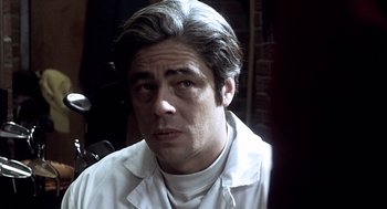 Movie still from “21 Grams” (2003), directed by Alejandro G. Iñárritu – A person wearing a white shirt; Close Up shot, Low angle