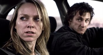 Movie still from “21 Grams” (2003), directed by Alejandro G. Iñárritu – A woman and a man sitting in the back of a car; Close Up shot, Over the shoulder angle