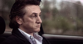 Movie still from “21 Grams” (2003), directed by Alejandro G. Iñárritu – A person sitting in a car looking out the window; Close Up shot, Low angle
