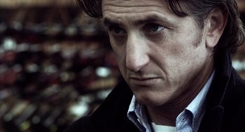 Movie still from “21 Grams” (2003), directed by Alejandro G. Iñárritu – A person wearing a jacket; Close Up shot, Over the shoulder angle