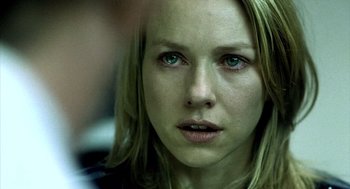 Movie still from “21 Grams” (2003), directed by Alejandro G. Iñárritu – A person with green eyes; Close Up shot, Over the shoulder angle