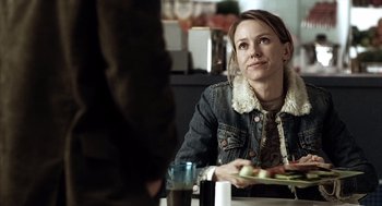 Movie still from “21 Grams” (2003), directed by Alejandro G. Iñárritu – A woman sitting at a table with a plate of food; Close Up shot, Over the shoulder angle
