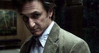 Movie still from “21 Grams” (2003), directed by Alejandro G. Iñárritu – A person wearing a suit and tie; Close Up shot, Low angle