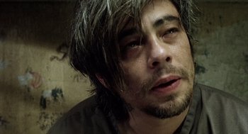 Movie still from “21 Grams” (2003), directed by Alejandro G. Iñárritu – A person with long hair; Close Up shot, Overhead angle