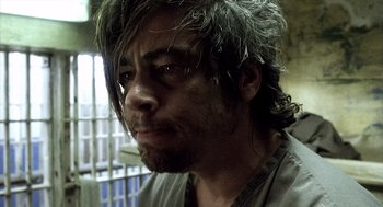 Movie still from “21 Grams” (2003), directed by Alejandro G. Iñárritu – A person with long hair; Close Up shot, Low angle