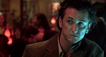 Movie still from “21 Grams” (2003), directed by Alejandro G. Iñárritu – A person wearing a jacket; Close Up shot, Low angle