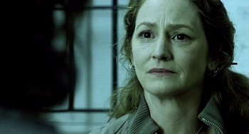 Movie still from “21 Grams” (2003), directed by Alejandro G. Iñárritu – An older woman is looking at the camera; Close Up shot, Over the shoulder angle