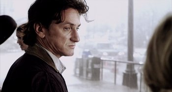 Movie still from “21 Grams” (2003), directed by Alejandro G. Iñárritu – A person looking out of a window; Close Up shot, Low angle