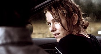 Movie still from “21 Grams” (2003), directed by Alejandro G. Iñárritu – A woman sitting in the driver's seat of a car; Close Up shot, Over the shoulder angle