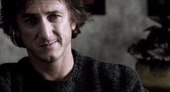 Movie still from “21 Grams” (2003), directed by Alejandro G. Iñárritu – A person wearing a black sweater; Close Up shot, Over the shoulder angle