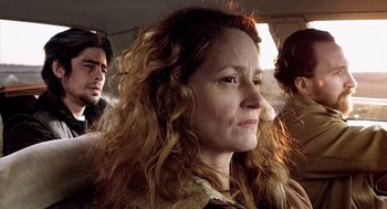 Movie still from “21 Grams” (2003), directed by Alejandro G. Iñárritu – A person sitting in a car; Close Up shot, Over the shoulder angle