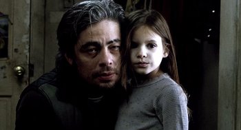 Movie still from “21 Grams” (2003), directed by Alejandro G. Iñárritu – A man and a little girl posing for a picture; Close Up shot, Low angle