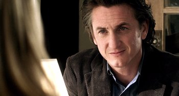 Movie still from “21 Grams” (2003), directed by Alejandro G. Iñárritu – A person wearing a jacket; Close Up shot, Over the shoulder angle