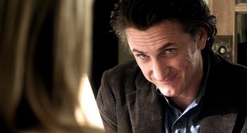 Movie still from “21 Grams” (2003), directed by Alejandro G. Iñárritu – A person wearing a jacket; Close Up shot, Over the shoulder angle