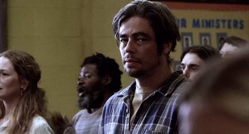 Movie still from “21 Grams” (2003), directed by Alejandro G. Iñárritu – A group of men standing in front of each other; Close Up shot, Over the shoulder angle