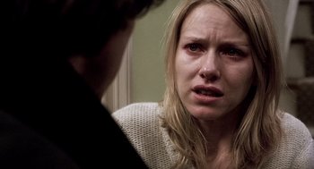 Movie still from “21 Grams” (2003), directed by Alejandro G. Iñárritu – A young woman is crying while talking to a young man; Close Up shot, Over the shoulder angle