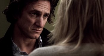 Movie still from “21 Grams” (2003), directed by Alejandro G. Iñárritu – A person looking at another person; Close Up shot, Over the shoulder angle