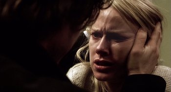 Movie still from “21 Grams” (2003), directed by Alejandro G. Iñárritu – A woman is crying while a man is touching her face; Close Up shot, Over the shoulder angle