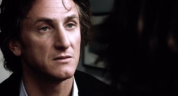 Movie still from “21 Grams” (2003), directed by Alejandro G. Iñárritu – A person with long hair; Close Up shot, Over the shoulder angle