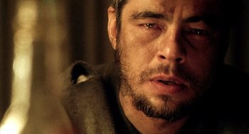 Movie still from “21 Grams” (2003), directed by Alejandro G. Iñárritu – A person with a beard; Close Up shot, Over the shoulder angle