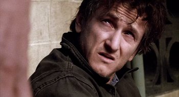 Movie still from “21 Grams” (2003), directed by Alejandro G. Iñárritu – A person wearing a jacket; Close Up shot, Over the shoulder angle