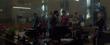 Movie still from “21 Jump Street” (2012), directed by Phil Lord – A group of people standing in a room; Wide shot, Over the shoulder angle